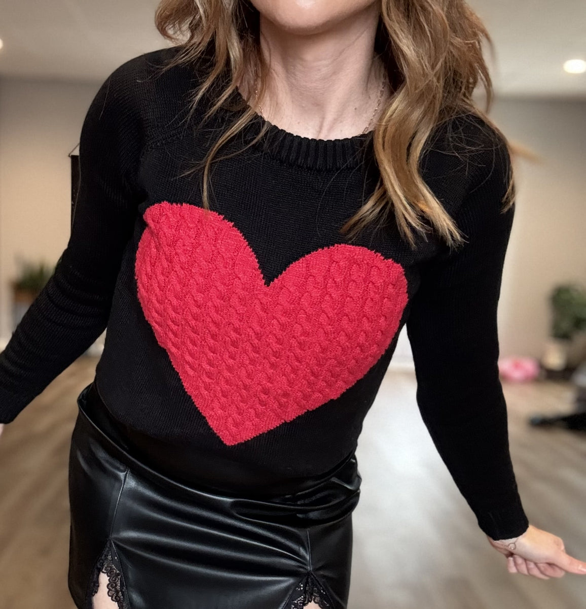 Black sweater with red heart hotsell